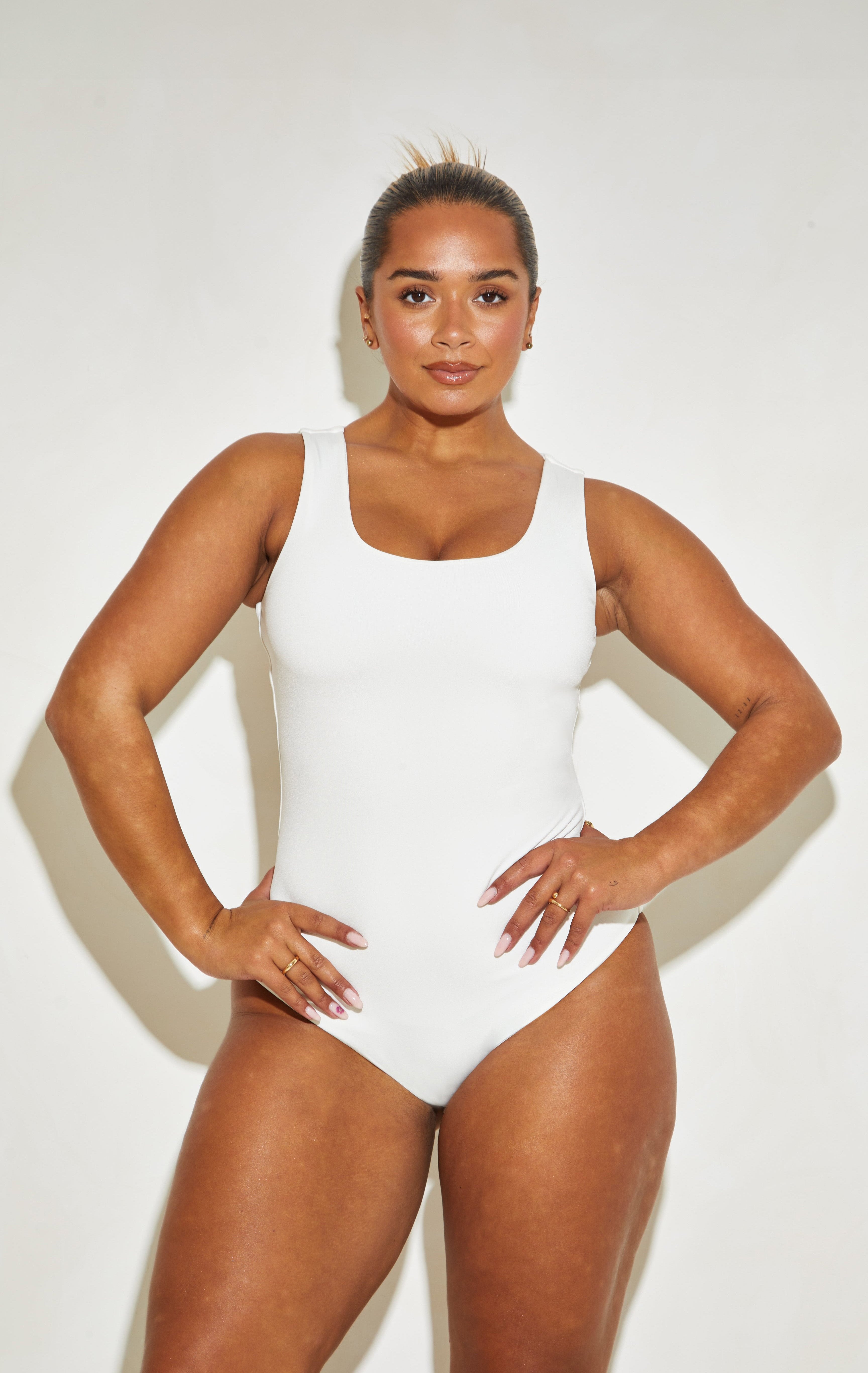 Coconut 'Joy' Sleeveless Bodysuit with Scoop Neck and Plunge Design